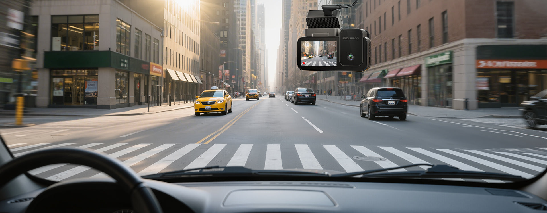 City street scene with a taxi and other vehicles from inside a car.