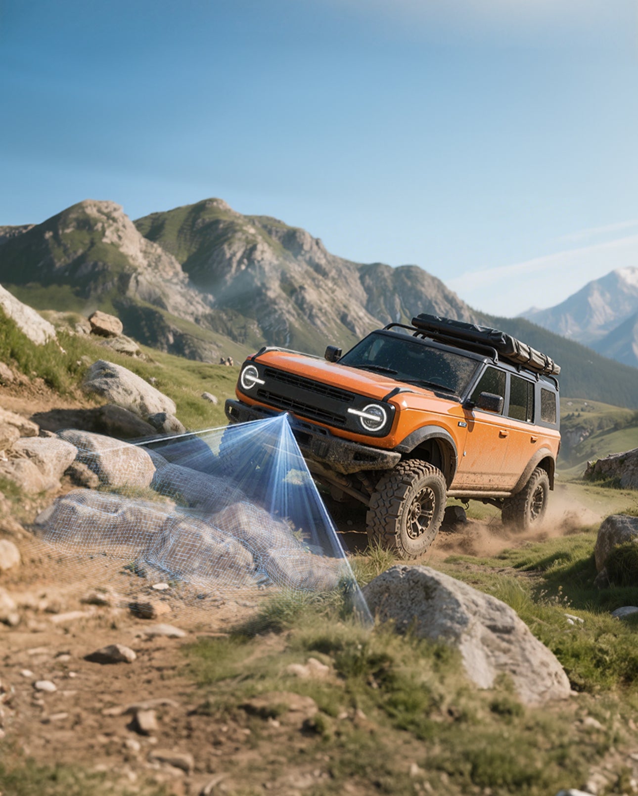Orange SUV driving on a rocky trail with mountains in the background